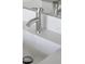 Modern bathroom with a chrome faucet and white countertop at 208 Snowy Orchid Way, Lake Alfred, FL 33850