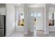Bright and airy entryway with hardwood floors and open view at 208 Snowy Orchid Way, Lake Alfred, FL 33850