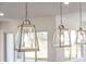 Modern pendant lights above kitchen island at 208 Snowy Orchid Way, Lake Alfred, FL 33850
