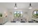 Bright dining room with a view to the backyard golf course and decorative lighting at 15820 Vetta Dr, Montverde, FL 34756