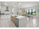 Bright open kitchen with stainless steel appliances, spacious island, and breakfast nook at 15820 Vetta Dr, Montverde, FL 34756