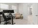 Home office with dual monitors, a comfortable chair, and a modern desk at 15820 Vetta Dr, Montverde, FL 34756