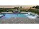 Relaxing backyard swimming pool and tanning ledge, including an outdoor seating area overlooking the golf course at 15820 Vetta Dr, Montverde, FL 34756