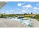 Backyard swimming pool and hot tub with outdoor seating areas, landscaping and golf course views at 15820 Vetta Dr, Montverde, FL 34756