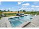 Inviting backyard pool and hot tub with an outdoor seating area, perfect for entertaining guests and Gathering at 15820 Vetta Dr, Montverde, FL 34756