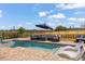 Relaxing outdoor swimming pool area with sun loungers, patio furniture, and a scenic view of the green landscape at 15820 Vetta Dr, Montverde, FL 34756