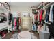 Spacious walk-in closet features multiple shelves, hanging racks, and drawers for organized storage at 15820 Vetta Dr, Montverde, FL 34756