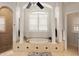 Spa-like bathroom with large soaking tub and separate shower at 6130 Blakeford Dr, Windermere, FL 34786