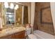 Bathroom boasts granite vanity, tiled shower, and bathtub at 6130 Blakeford Dr, Windermere, FL 34786