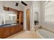 Large bathroom with soaking tub, walk-in shower, and double vanity at 6130 Blakeford Dr, Windermere, FL 34786