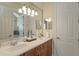 Elegant bathroom with double vanity and large mirror at 6130 Blakeford Dr, Windermere, FL 34786