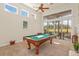 Game room with pool table and view of golf course at 6130 Blakeford Dr, Windermere, FL 34786