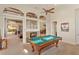 Game room features a pool table, fireplace and access to backyard at 6130 Blakeford Dr, Windermere, FL 34786