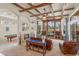 Spacious Gathering room with wood beams, fireplace & pool view at 6130 Blakeford Dr, Windermere, FL 34786