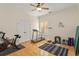 Bright home gym with Peloton bike, treadmill, and weights at 6130 Blakeford Dr, Windermere, FL 34786