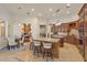 Elegant kitchen with granite island, breakfast nook, and a view of the pool at 6130 Blakeford Dr, Windermere, FL 34786