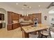 Open concept kitchen with granite countertops, custom cabinetry, and an island at 6130 Blakeford Dr, Windermere, FL 34786