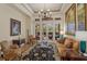 Relaxing living room with French doors opening to pool area at 6130 Blakeford Dr, Windermere, FL 34786