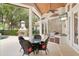 Covered patio features an outdoor kitchen, dining area, and fireplace at 6130 Blakeford Dr, Windermere, FL 34786