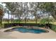 Inviting pool with spa and fountain, surrounded by lush landscaping at 6130 Blakeford Dr, Windermere, FL 34786