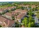 Aerial perspective of the townhome community, highlighting its layout and surroundings at 637 Pavia Loop, Lake Mary, FL 32746