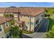 Aerial view showcasing a townhome's location within a community with a curved driveway at 637 Pavia Loop, Lake Mary, FL 32746