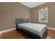 Cozy bedroom featuring a window and a bed with simple furnishings and plenty of natural light at 637 Pavia Loop, Lake Mary, FL 32746