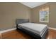 Simple bedroom with wood flooring and a window at 637 Pavia Loop, Lake Mary, FL 32746