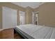 Simple bedroom with wood flooring and access to other rooms at 637 Pavia Loop, Lake Mary, FL 32746