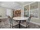 Kitchen breakfast nook with granite table and wrought iron chairs at 637 Pavia Loop, Lake Mary, FL 32746