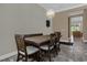 Dining area with a wood table and bench seating for six at 637 Pavia Loop, Lake Mary, FL 32746