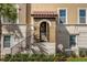 Inviting townhome entrance with a covered entryway and wrought-iron railing at 637 Pavia Loop, Lake Mary, FL 32746