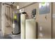 Mechanical room featuring a water heater, water softener, and other utility components at 637 Pavia Loop, Lake Mary, FL 32746