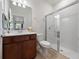 Clean bathroom featuring a vanity with solid surface countertops and glass enclosed shower at 2542 Cliff Way, St Cloud, FL 34771