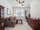 Functional bedroom featuring carpeted floors, a ceiling fan, and furniture at 2542 Cliff Way, St Cloud, FL 34771