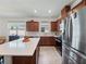 Bright kitchen with stainless steel appliances, a large island, and ample cabinet space at 2542 Cliff Way, St Cloud, FL 34771