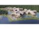 Stunning aerial view of the resort, water park, lakes and lush green landscape at 14501 Grove Resort Ave # 3109, Winter Garden, FL 34787