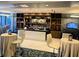 Chic bar area with ample seating, a well-stocked bar, and modern decor at 14501 Grove Resort Ave # 3109, Winter Garden, FL 34787