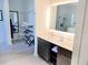 Bright bathroom with walk-in closet, double vanity, and glass-enclosed shower at 14501 Grove Resort Ave # 3109, Winter Garden, FL 34787