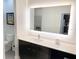 This modern bathroom features a large mirror, updated vanity, and sleek design at 14501 Grove Resort Ave # 3109, Winter Garden, FL 34787