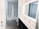 Modern bathroom featuring a tub/shower combination and illuminated mirror for a clean, bright space at 14501 Grove Resort Ave # 3109, Winter Garden, FL 34787