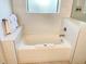 Inviting bathroom with a tub and white marble tile that enhances the room’s style at 14501 Grove Resort Ave # 3109, Winter Garden, FL 34787