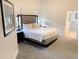 Comfortable bedroom with bedside tables and ensuite bathroom at 14501 Grove Resort Ave # 3109, Winter Garden, FL 34787