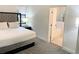 Comfortable bedroom with access to the ensuite bathroom with separate shower and tub at 14501 Grove Resort Ave # 3109, Winter Garden, FL 34787