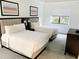 Serene bedroom with two beds, large windows and tasteful décor creates a cozy and inviting atmosphere at 14501 Grove Resort Ave # 3109, Winter Garden, FL 34787