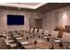 Modern conference room with a large table, comfortable chairs, and a large screen at 14501 Grove Resort Ave # 3109, Winter Garden, FL 34787