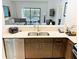 Modern kitchen with stainless steel appliances and a view of the living room at 14501 Grove Resort Ave # 3109, Winter Garden, FL 34787