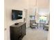 Sitting room featuring armchairs, a side table, and a flatscreen TV on the wall at 14501 Grove Resort Ave # 3109, Winter Garden, FL 34787