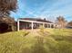 Landscaped backyard with large covered patio at 32702 View Haven Ln, Sorrento, FL 32776