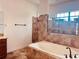 Bathroom with soaking tub and walk-in shower at 32702 View Haven Ln, Sorrento, FL 32776